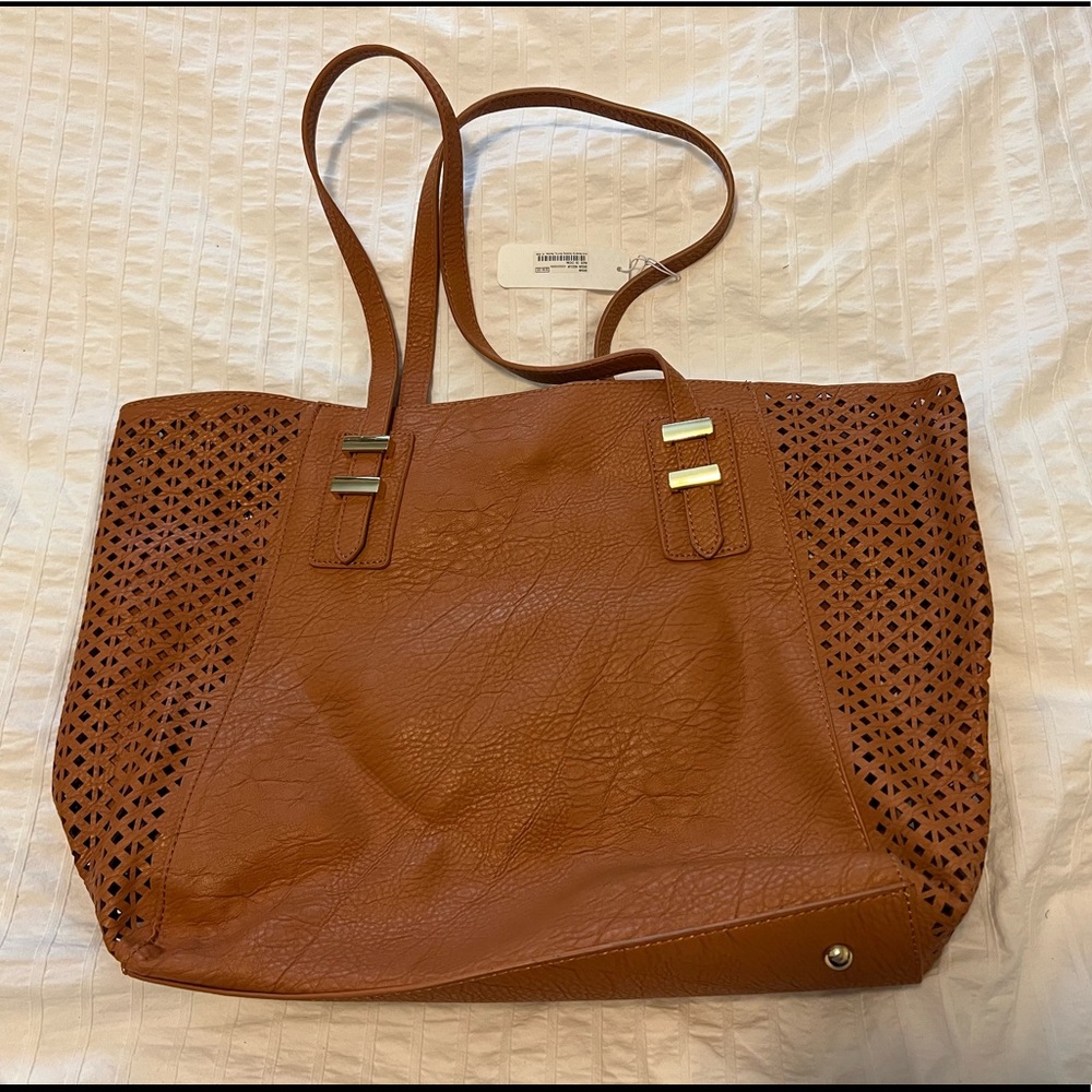 Tote style beach bag with interior zipper bag